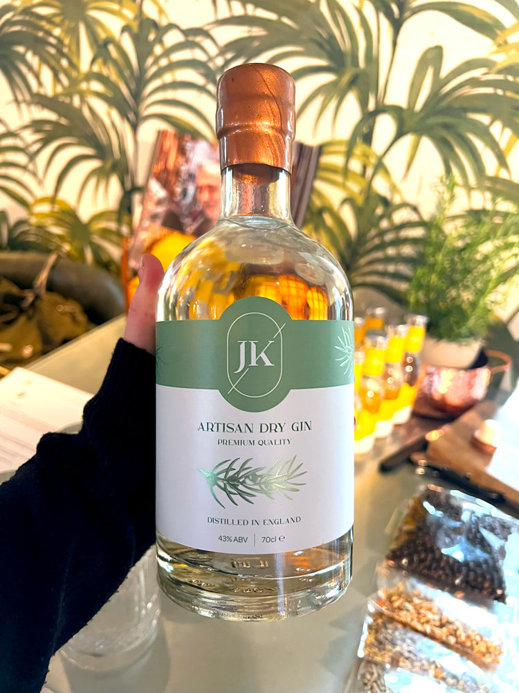 Hand holding bottle of JK Gin.